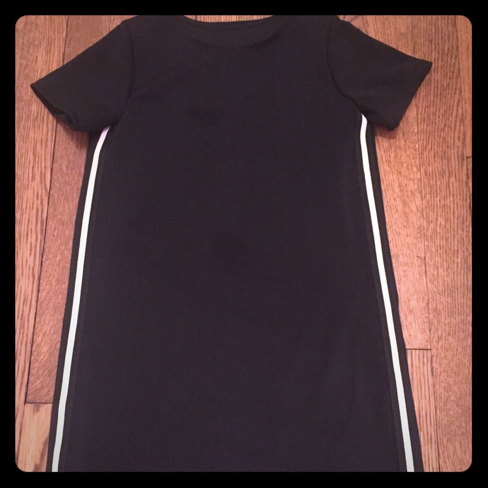 Black, short sleeved black dress.